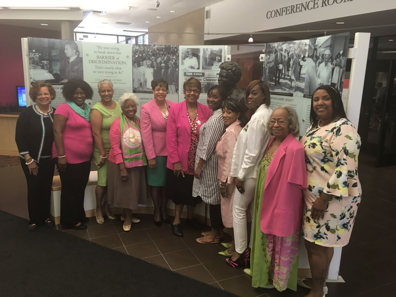 group of people in front of art display