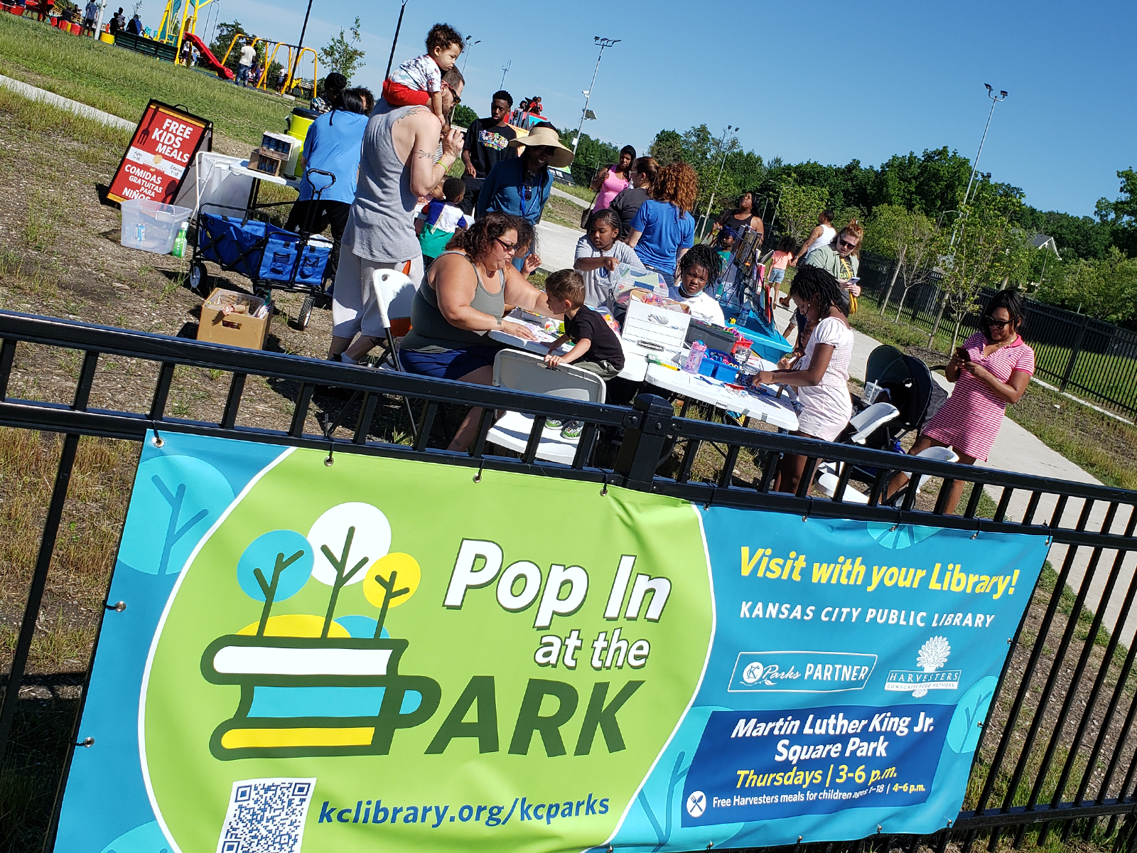 group of adults and children near a park