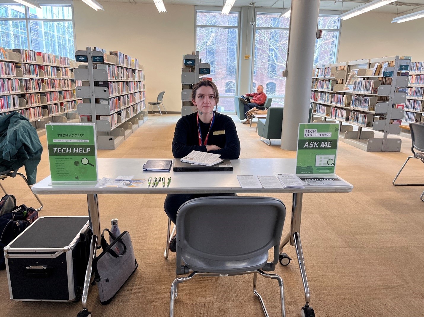 Woman seated at a table in the Library
