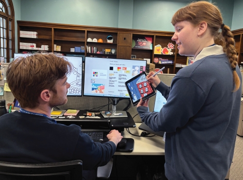 Graphic designers Katelyn Betz and Alex Skorija