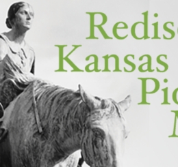 statue of man leading horse with woman riding