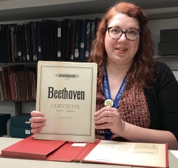 staff member with orchestral set