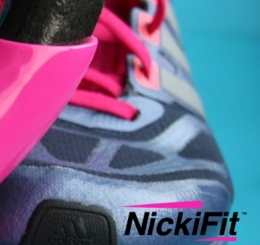 pink kettlebell by tennis shoes