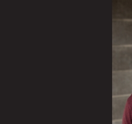 man with glasses smiles