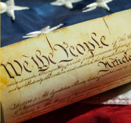 Constitution rolled on flag