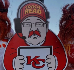 two men by cardboard cutout