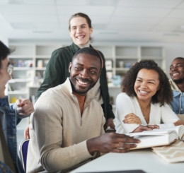 5 people in discussion at table