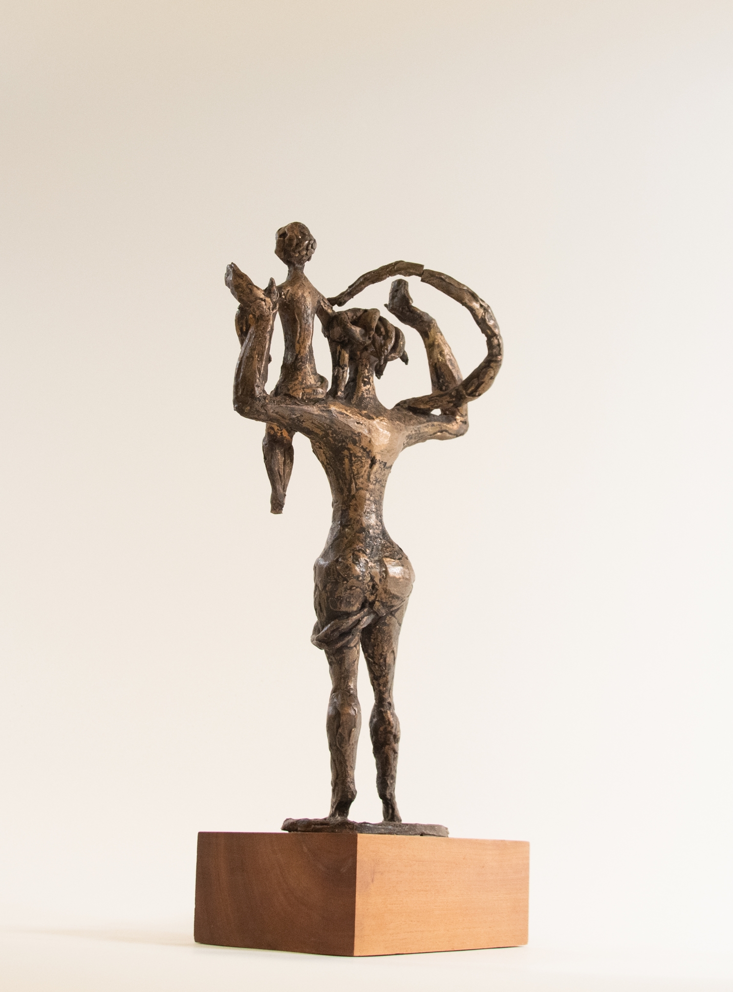 Mother Lifting Child, back