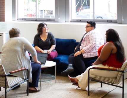 Group of four having a discussion