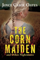 A young, caucasian girl with light blonde hair in braided pigtails stands in a field of corn with her back to the viewer