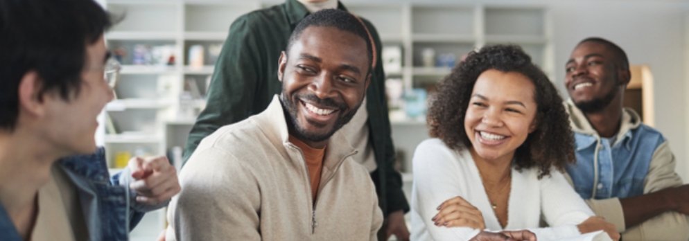 5 people in discussion at table