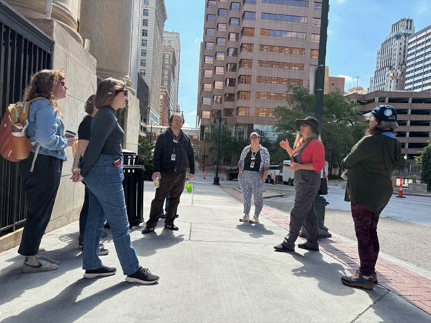 A group of Library staffers gathers for an Urban Hike outside the Central Library.