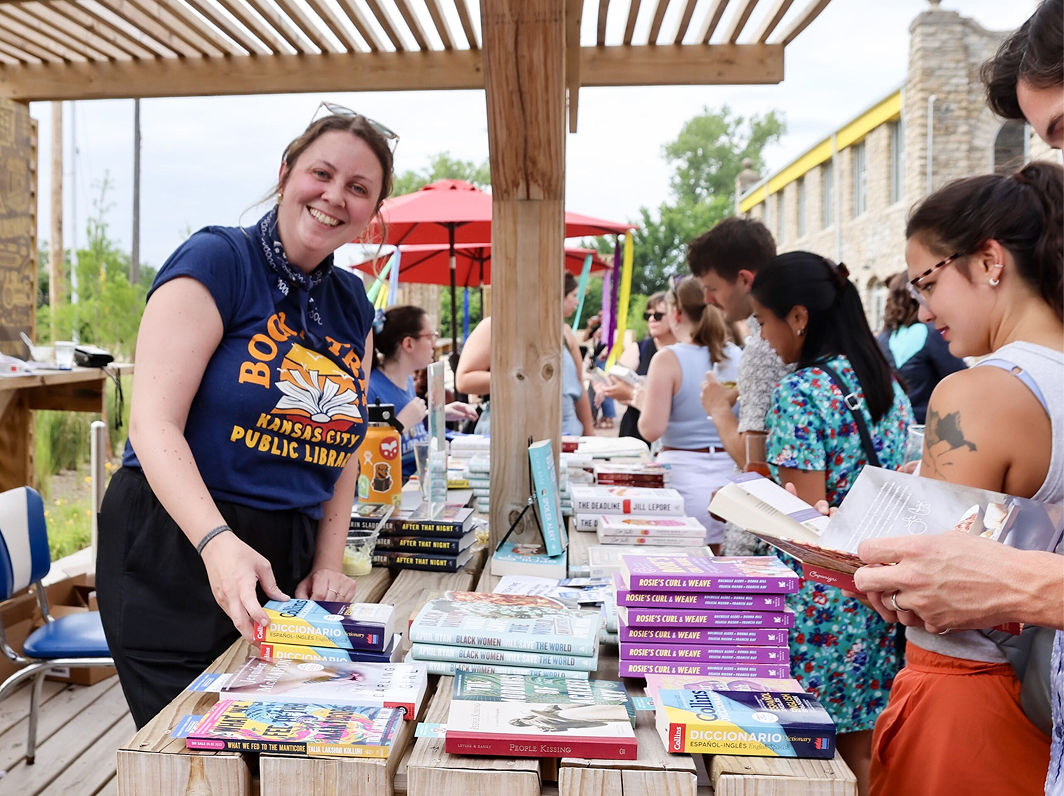 people look at books on a table