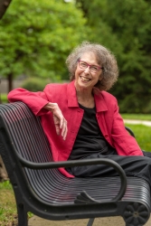 Author sits on bench.