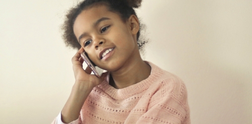 girl with pigtails on phone