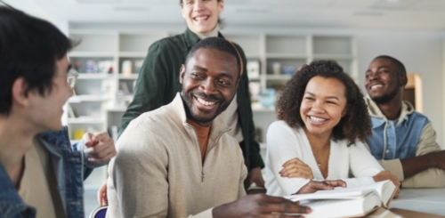 5 people in discussion at table